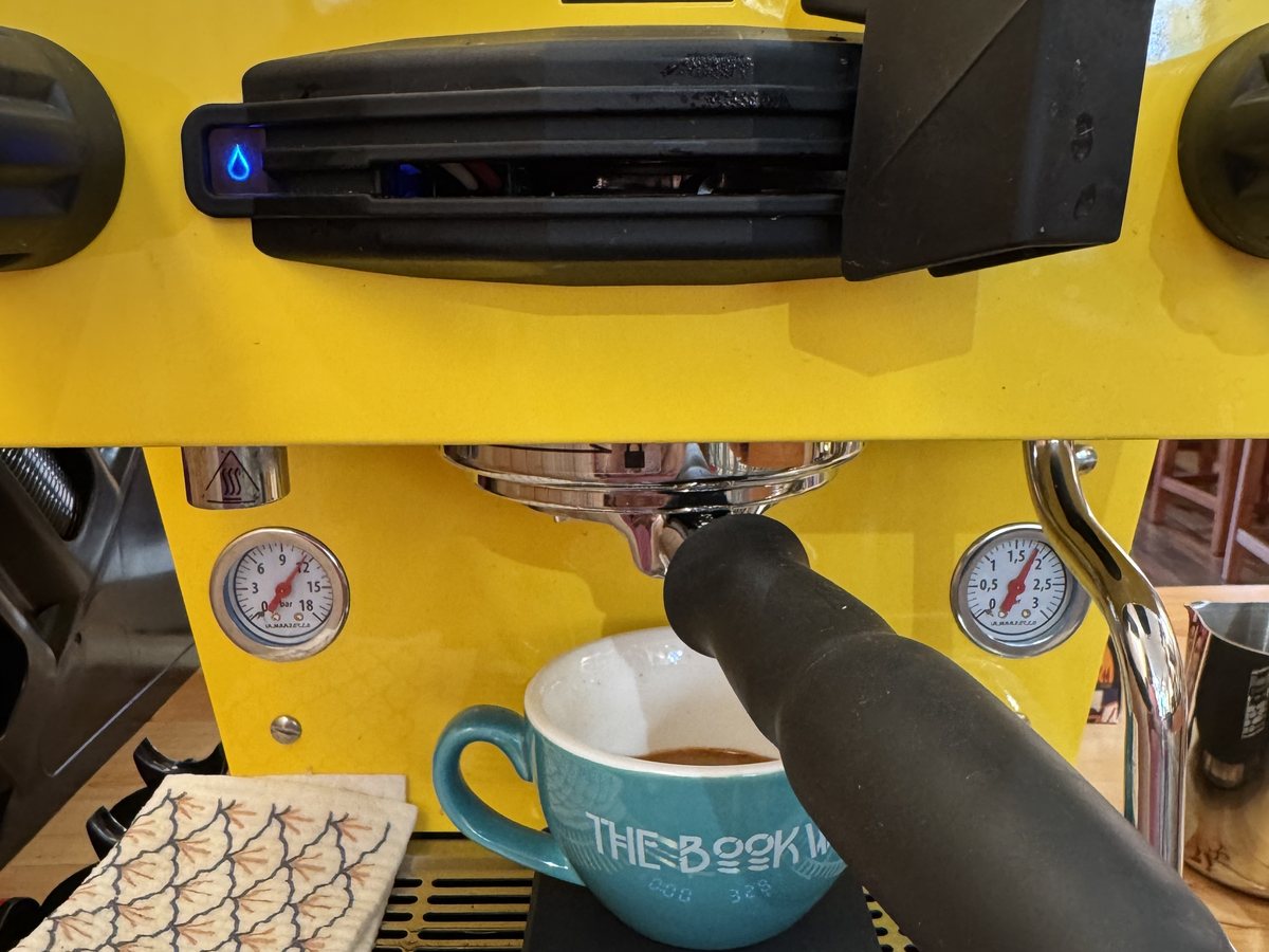 Espresso being pulled into a Bookworm cup