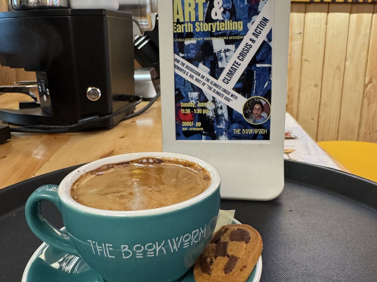 Coffee and a cookie beside an event card